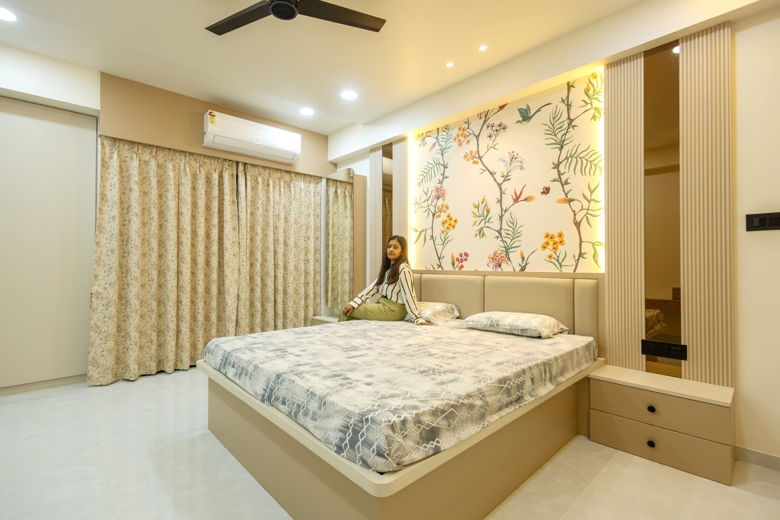 Bedroom with a botanical feature wall and coordinated bedside storage