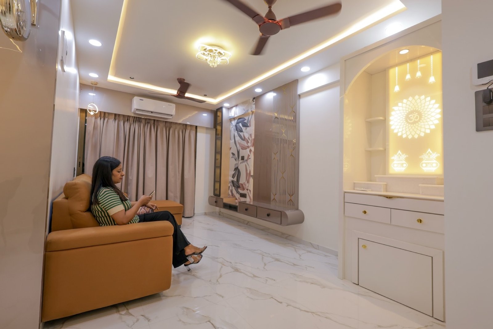 Living room with layered lighting and a coordinated finish palette